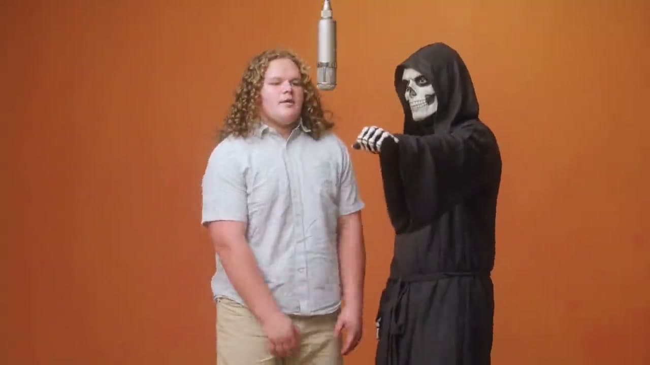 Hotel Lobby AI video showing a young man and a Grim Reaper costume in an orange booth