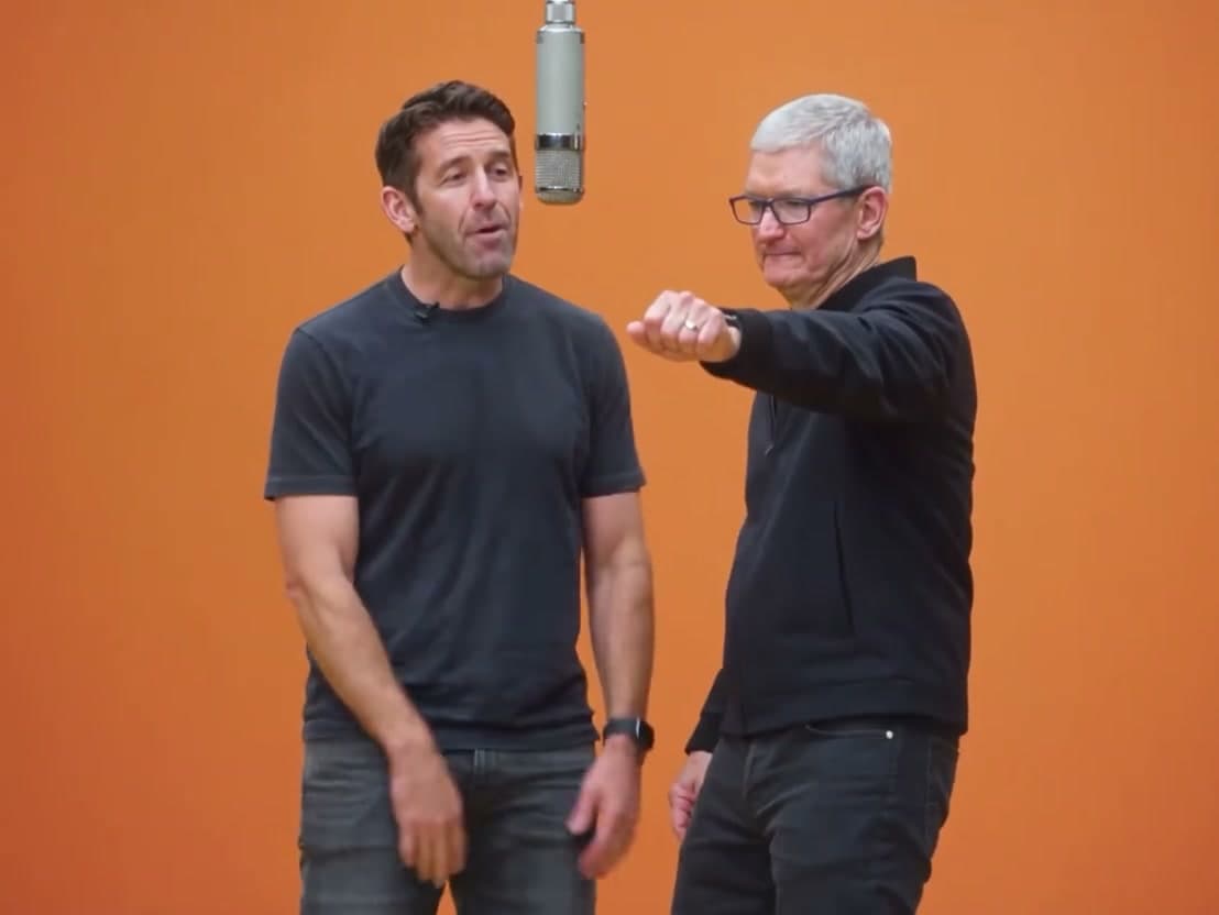 Hotel Lobby AI video showing two men in casual and executive outfits in an orange studio booth